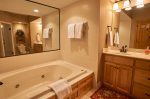 Master bath with Jacuzzi tub and separate shower